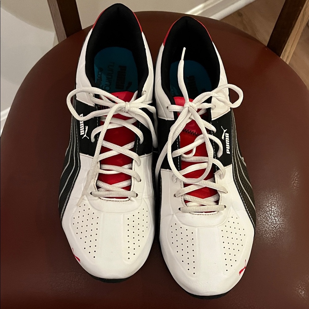 Puma White and Black Athletic Shoes with Red Highlights